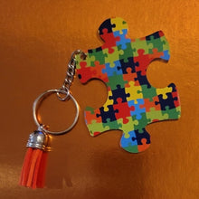 Load image into Gallery viewer, Support those you love with this puzzle design autism keychain with a tassel.
