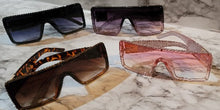 Load image into Gallery viewer, Sunglasses that sparkle with some bling. You will shine while blocking the sunshine. Each lux glass rhinestone is hand placed with care. These sparkle shades come in Black, Pink Ombre, Black Ombre or Spicy Leopard.
