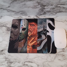 Load image into Gallery viewer, All of your favorite Halloween movie killers mouse pad. Add a little fright to your home office or at work with this Halloween theme mouse pad.
