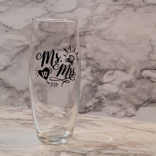 Celebrate your wedding or anniversary birthday with a glitz and glam stemless champagne glass. Add a name and/or special date to remember your day forever. You can a pick the vinyl color to match your special day.  Great for weddings and anniversaries.