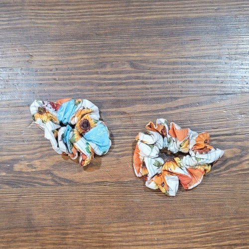 Handmade pumpkin & sunflower hair scrunchie. A comfortable way to keep your hair up and it even looks cute on your wrist when you want to take your hair down.  