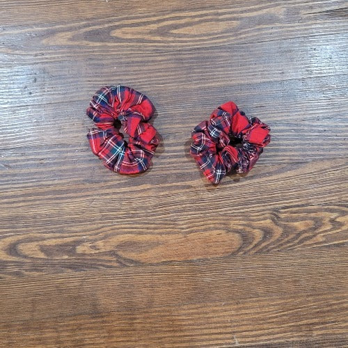 The Makayla plaid handmade hair scrunchie. A comfortable way to keep your hair up and it even looks cute on your wrist when you want to take your hair down.  