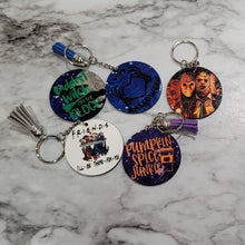 Load image into Gallery viewer, Double-sided Halloween sublimation keychain that you can customize or personalize with your favorite pictures, business logo, memory, team, sayings or characters. Put a picture on the front and a special date or saying on the back.  Choose a premade design or design your own Sublimated and handmade 2 inches circle (images/sayings will be cropped to fit) Tassel color will be chosen to match as close as possible waterproof, durable and long lasting
