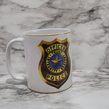 Load image into Gallery viewer, This Police Officer mug is the perfect way to say thank you, show love and support to a local hero. Let them know how much they are appreciated for all that they do. It is vibrant, long lasting, and durable. Add a name to take it to the next level.  You can put hot and cold drinks in them. 
