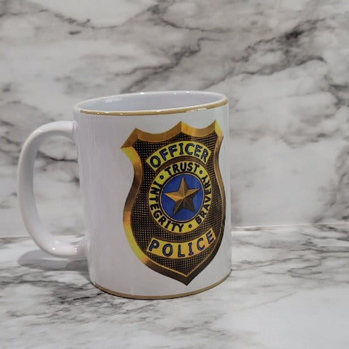 This Police Officer mug is the perfect way to say thank you, show love and support to a local hero. Let them know how much they are appreciated for all that they do. It is vibrant, long lasting, and durable. Add a name to take it to the next level.  You can put hot and cold drinks in them. 