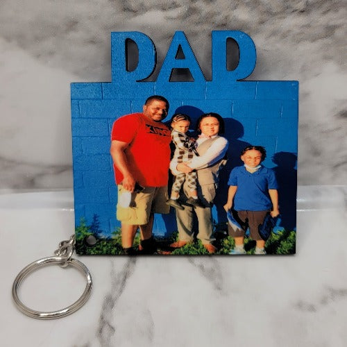 Create your own double-sided mom, dad, or R.I.P. sublimation keychain that you can customize or personalize. Put a picture on the front and a special date or saying on the back. Take that special memory with you on the go.  Sublimated and handmade 3 inches approx.  (images/sayings will be cropped to fit) Tassel color will be chosen to match as close as possible Waterproof, durable and long lasting